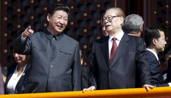 Chinese President Xi Jinping, left, with former President Jiang Zemin on the Tiananmen Gate in Beijing (Reuters)
