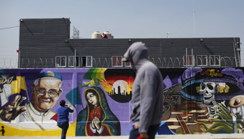 A woman takes photos of graffiti of Pope Francis in Ecatepec, on the outskirts of Mexico City (Reuters/Edgard Garrido)