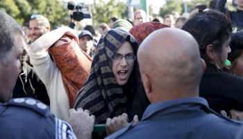 Israeli ultranationalists protest during a court hearing into a West Bank arson attack (Reuters/Baz Ratner)