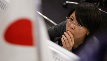 A foreign currency dealer in Tokyo (Reuters/Yuriko Nakao)