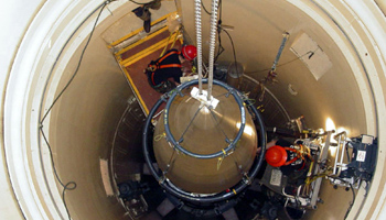 A US Air Force missile maintenance team removes the upper section of an intercontinental ballistic missile  (Reuters/USAF/Airman John Parie/handout via Reuters)