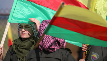 Fighters with the Syrian Kurdish flag (Reuters/Rodi Said)