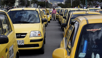 Taxi drivers in Bogota block the street in protest against Uber (Reuters/John Vizcaino)