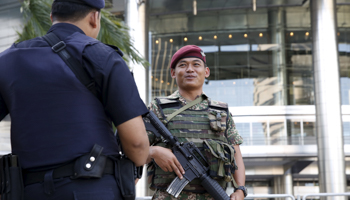 A soldier patrols outside a shopping mall in Kuala Lumpur, Malaysia (Reuters/Olivia Harris)