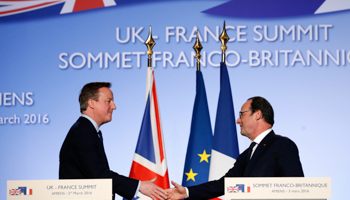 President Francois Hollande shakes hands with Prime Minister David Cameron after a joint news conference during a Franco-British summit in Amiens, northern France (Reuters/Philippe Wojazer)