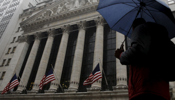 A man passes by the New York Stock Exchange (Reuters/Brendan McDermid)