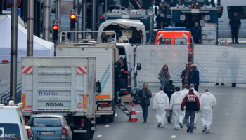 Forensics experts at the Maalbeek metro station following an explosion in Brussels (Reuters/Vincent Kessler)