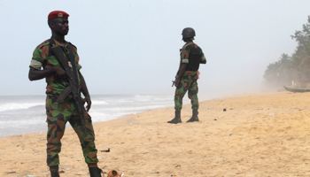 Soldiers stand guard on the beach following an attack in Grand Bassam, Ivory Coast (Reuters/Luc Gnago)