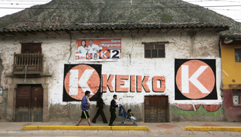 People walk past campaign electoral signs of Peru's presidential candidate Keiko Fujimori in Cuzco (Reuters/Janine Costa)