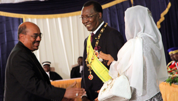 : Sudan's President Omar al-Bashir, left, congratulates Chad's President Idriss Deby and first lady Hina at Deby’s inauguration in 2011 (Reuters/Stringer)