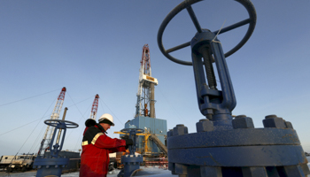 A worker at the Lukoil company owned Imilorskoye oil field outside Kogalym, Russia (Reuters/Sergei Karpukhin/Files)