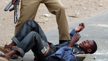 A protestor is held down by police in Lusaka (Reuters/Salim Henry)