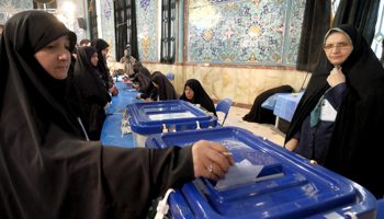 An Iranian woman casts her ballot in the parliamentary election (Reuters/Raheb Homavandi)