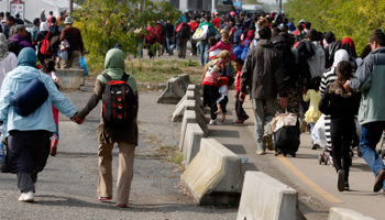 Migrants walk towards the Austrian border from Hegyeshalom, Hungary (Reuters/Leonhard Foeger)