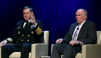 Admiral Michael Rogers, director of US National Security Agency, NSA, with CIA Director John Brennan, right, during a conference on national security (Reuters/Yuri Gripas)