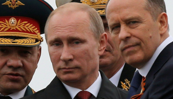 President Vladimir Putin, centre, Defence Minister Sergei Shoigu, left, and Russia's Federal Security Service Director Alexander Bortnikov (Reuters/Maxim Shemetov/File Photo)