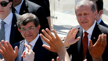 President Tayyip Erdogan, right, and Prime Minister Ahmet Davutoglu (Reuters/Umit Bektas/File Photo)