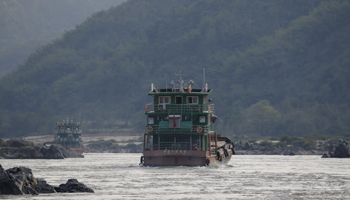 Chinese cargo ships sail on the Mekong river near the Golden Triangle at the border between Laos, Myanmar and Thailand (Reuters/Jorge Silva)