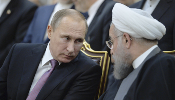 Russian President Vladimir Putin speaks with his Iranian counterpart Hassan Rouhani in Tehran (Reuters/Alexei Druzhinin/Sputnik/Kremlin)