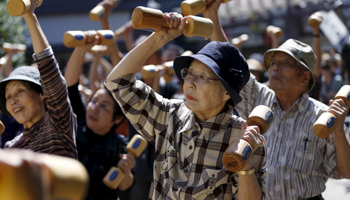 Elderly people exercise during an event to mark Japan's 'Respect for the Aged Day' in Tokyo (Reuters/Issei Kato)