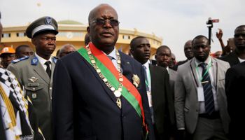 Burkina Faso President Roch Marc Kabore leaves his 2015 swearing in ceremony (Reuters/Sophie Garcia)