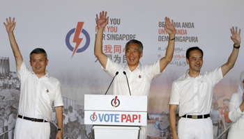 Singapore's Prime Minister Lee Hsien Loong, centre, thanks supporters with his team after the general election results (Reuters/Edgar Su)