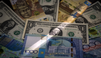 Kazakhstan's tenge and US dollars banknotes (Reuters/Shamil Zhumatov)