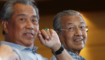 Malaysia's former Deputy Prime Minister Muhyiddin Yassin, left, and former Prime Minister Mahathir Mohamad in Kuala Lumpur (Reuters/Olivia Harris)