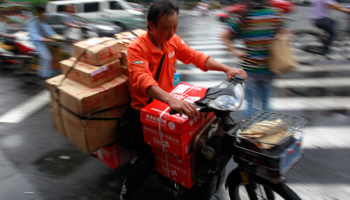 Motorcycle courier in Shanghai (Reuters/Aly Song)