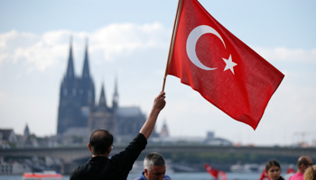 A supporter of Turkish President Tayyip Erdogan waves a Turkish flag during a pro-government protest in Cologne, Germany July 31, 2016. (Reuters/Vincent Kessler)