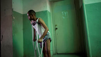 A patient walks in a corridor in the Hospital of the State University of Haiti (Reuters/Andres Martinez Casares)