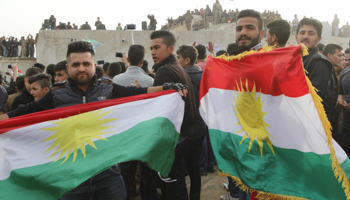 Kirkuk residents wave the Kurdish flag during Nowroz celebrations (Reuters/Ako Rasheed)