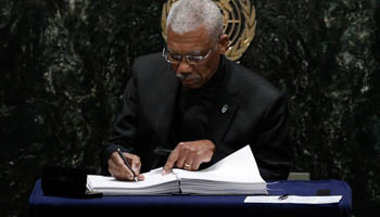 President David Granger signs the Paris agreement on climate change (Reuters/Mike Segar)