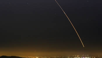 An unarmed Minuteman III intercontinental ballistic missile streaks through the sky of Vandenberg in California (Reuters)