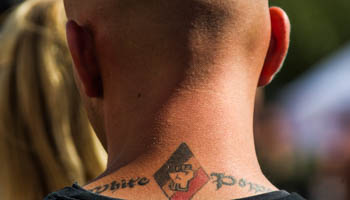 White Power' tattoo on a far-right supporter, 2012 (Reuters/Thomas Peter)