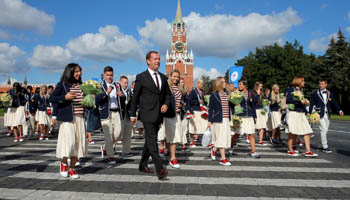 Russian Prime Minister Dmitry Medvedev and members of the Russian Olympic team (Reuters/Maxim Shemetov)