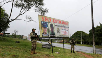 A billboard saying "kidnapped by the EPP", near where eight soldiers were killed on August 27 (Reuters/Jorge Adorno)