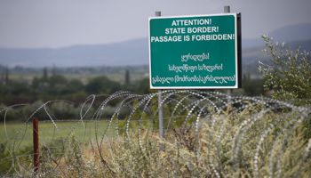 A boundary sign warns Georgians not to enter territory claimed by South Ossetia (Reuters/David Mdzinarishvili)