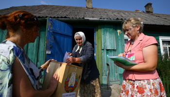 A woman casts her ballot during a parliamentary election, Belarus (Reuters/Vasily Fedosenko)
