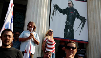 Labour Minister Giorgos Katrougalos depicted as Edward Scissorhands at a demonstration in Athens on September 16 by Communist-affiliated trade union. (Reuters/Alkis Konstantinidis)