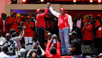 Kenya's President Uhuru Kenyatta and his Deputy William Ruto salute supporters at the official Jubilee Party launch ahead of the 2017 general elections (Reuters/Thomas Mukoya)
