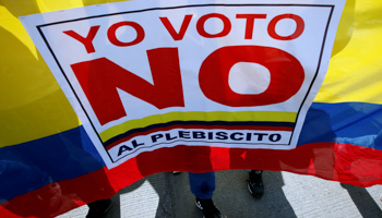 Demonstrators shout "I vote NO to the plebiscite" to protest the government's peace agreement with the Revolutionary Armed Forces of Colombia (Reuters/John Vizcaino)