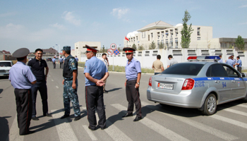 Investigators, Interior Ministry officers and security forces at the site of a bomb blast outside China's embassy in Bishkek, Kyrgyzstan (Reuters/Vladimir Pirogov)