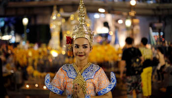 A Thai classical dancer poses for photos at the Erawan shrine in central Bangkok, Thailand (Reuters/Jorge Silva)