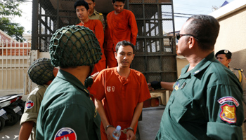 Cambodia's opposition National Rescue Party supporter Roeun Chetra arrives at court to hear a verdict over insurrection charges against him (Reuters/Samrang Pring)