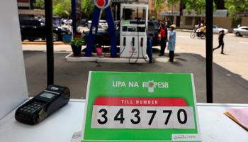 An M-Pesa till number is displayed at a petrol station for customers using the money transfer facility in Kenya's capital Nairobi (Reuters/Noor Khamis)