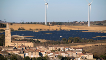General view shows wind turbines behind rows of solar panels in Avignonet-Lauragais, France (Reuters/Fred Lancelot)
