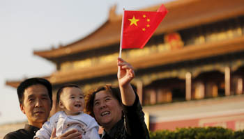 A couple and their grandchild in Tiananmen Square (Reuters/Kim Kyung)