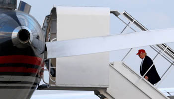 US President-elect Donald Trump boards his aircraft in Florida, US (Reuters/Joe Skipper)