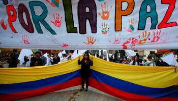 Supporters rallying for the nation’s new peace agreement with FARC in Bogota, Colombia (Reuters/John Vizcaino)